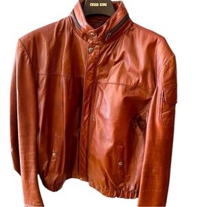 Vintage Red/Brown Leather Jacket with Numerous Pockets by Chess King.  Size=44.